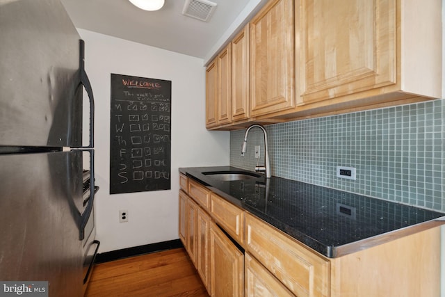 2016 Christian St Unit C, Philadelphia, PA 19146 - kitchen with freestanding refrigerator, dark wood-style flooring, backsplash, and light brown cabinetry