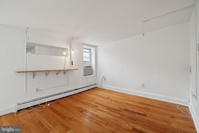 2016 Christian St Unit C, Philadelphia, PA 19146 - spare room with a baseboard heating unit, light wood-style flooring, and cooling unit