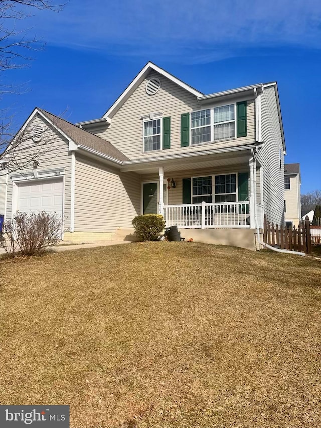 6483 Sedgwick St, Elkridge, MD 21075 - traditional home featuring an attached garage and covered porch