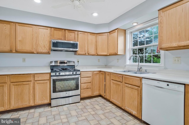 6483 Sedgwick St, Elkridge, MD 21075 - kitchen featuring appliances with stainless steel finishes, light brown cabinets, light countertops, and recessed lighting