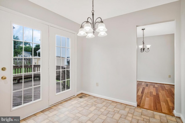 6483 Sedgwick St, Elkridge, MD 21075 - unfurnished dining area featuring a chandelier and stone finish floors