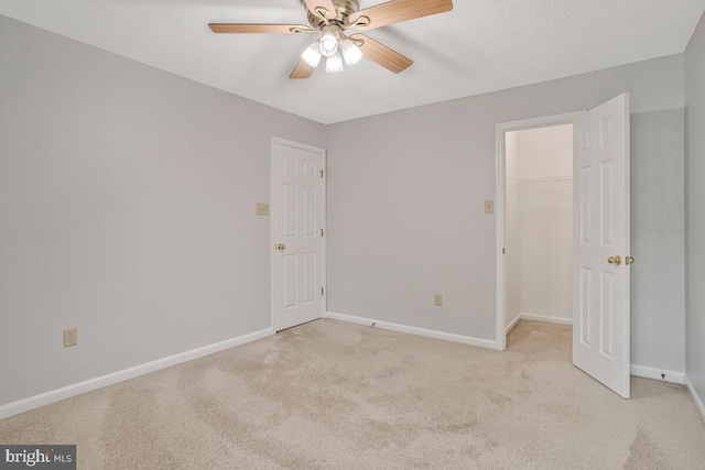 6483 Sedgwick St, Elkridge, MD 21075 - unfurnished bedroom with light colored carpet, a walk in closet, a ceiling fan, and a closet