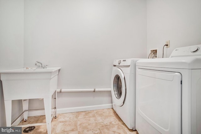 6483 Sedgwick St, Elkridge, MD 21075 - laundry room with washer and dryer and baseboards