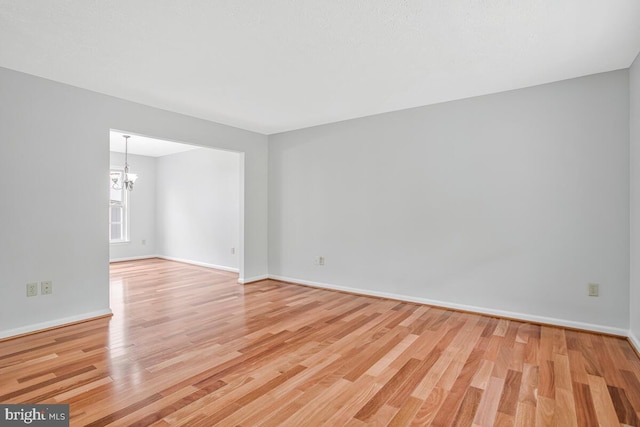 6483 Sedgwick St, Elkridge, MD 21075 - empty room with a chandelier and wood finished floors