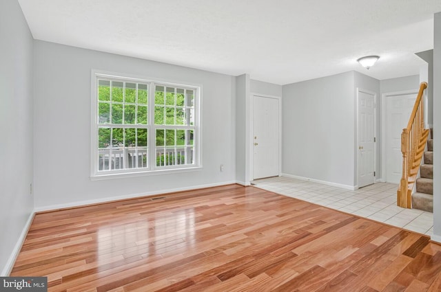 6483 Sedgwick St, Elkridge, MD 21075 - unfurnished room with stairway and wood finished floors