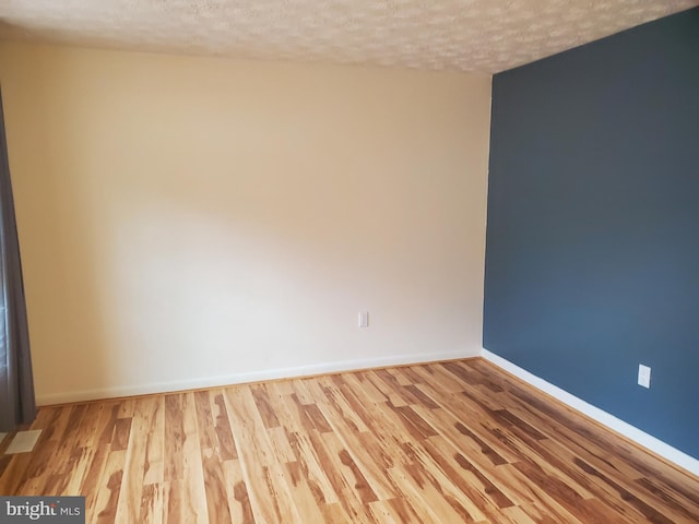 505 Northview Rd, Mount Airy, MD 21771 - empty room featuring wood finished floors and a textured ceiling