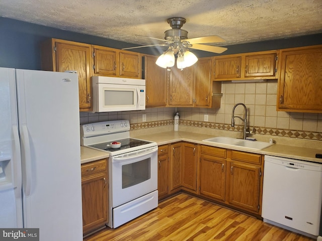 505 Northview Rd, Mount Airy, MD 21771 - kitchen with white appliances, light wood-type flooring, tasteful backsplash, light countertops, and a textured ceiling