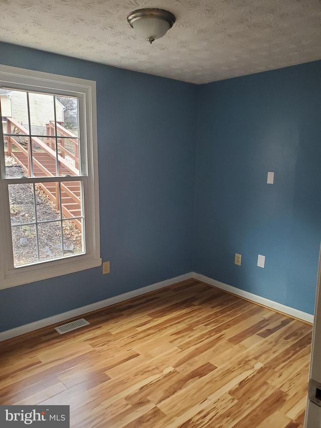 505 Northview Rd, Mount Airy, MD 21771 - unfurnished room with light wood-type flooring and a textured ceiling