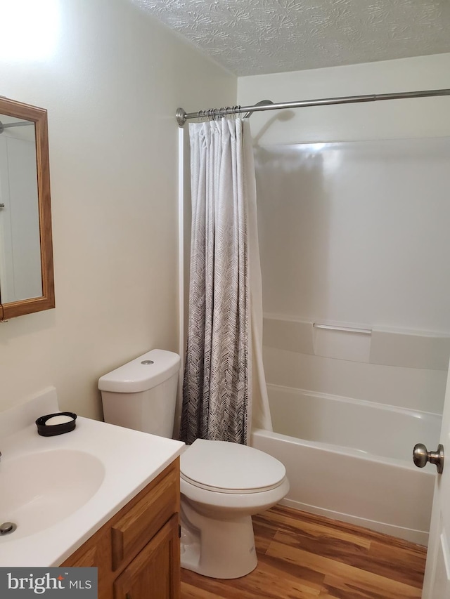 505 Northview Rd, Mount Airy, MD 21771 - bathroom featuring vanity, wood finished floors, shower / bath combo, and a textured ceiling