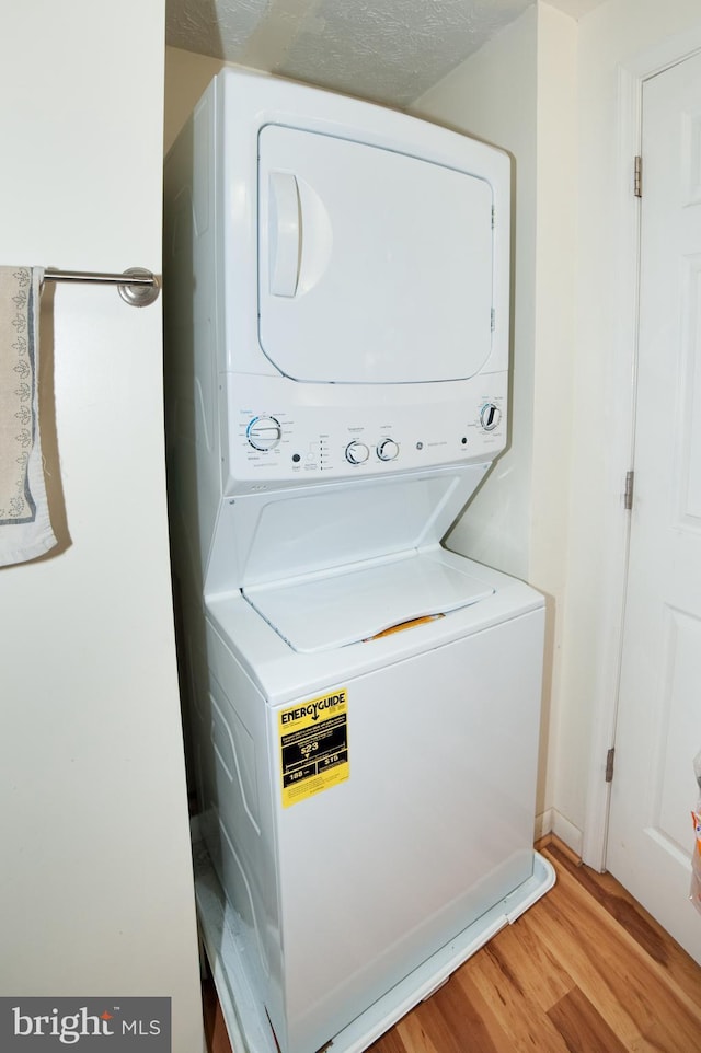505 Northview Rd, Mount Airy, MD 21771 - washroom featuring stacked washer and clothes dryer and light wood-style flooring