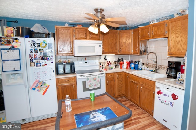 505 Northview Rd, Mount Airy, MD 21771 - kitchen with white appliances, ceiling fan, decorative backsplash, light countertops, and a textured ceiling