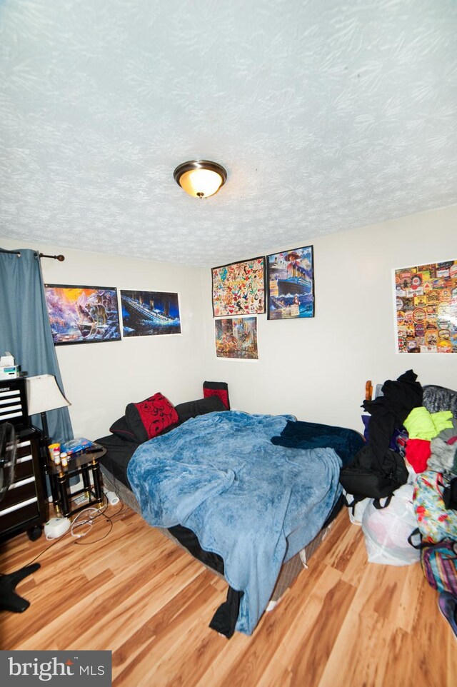 505 Northview Rd, Mount Airy, MD 21771 - bedroom featuring wood finished floors and a textured ceiling