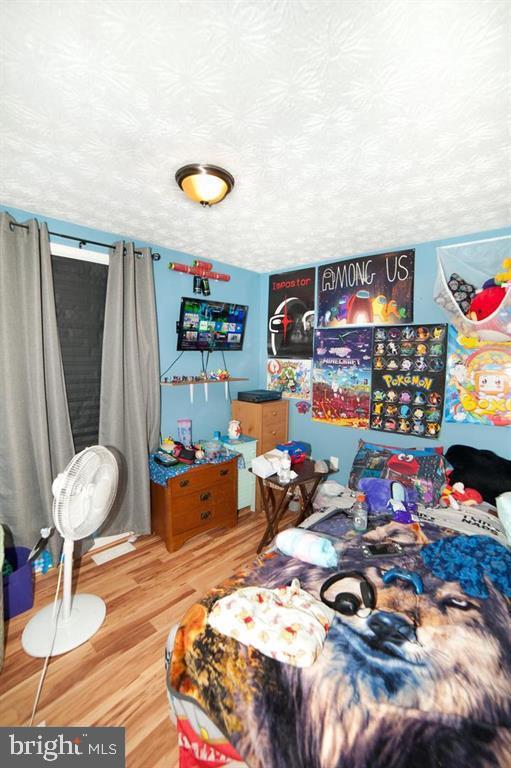 505 Northview Rd, Mount Airy, MD 21771 - bedroom featuring wood finished floors and a textured ceiling