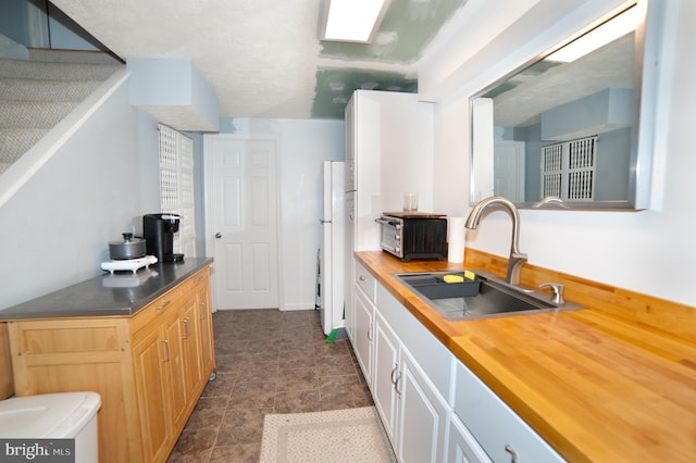 505 Northview Rd, Mount Airy, MD 21771 - kitchen with butcher block countertops, freestanding refrigerator, and white cabinets