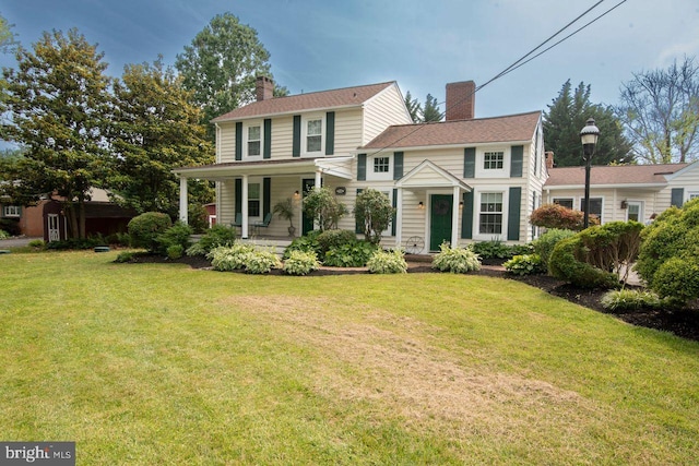 716 Old Fallston Rd, Fallston, MD 21047 - view of front of house with a chimney, a front yard, and covered porch