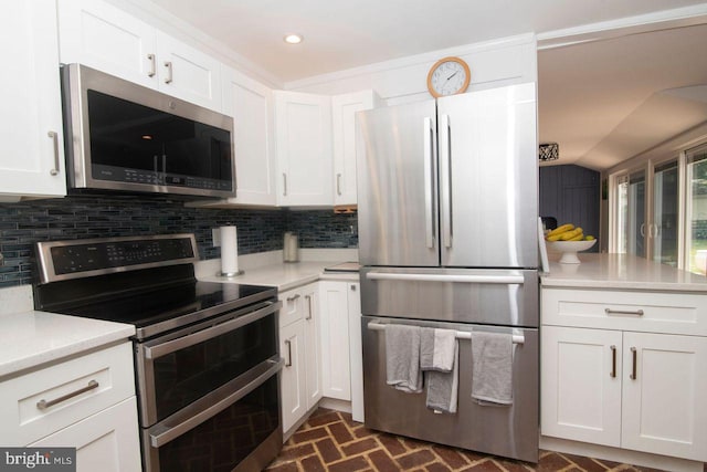 716 Old Fallston Rd, Fallston, MD 21047 - kitchen featuring stainless steel appliances, brick floors, light countertops, white cabinetry, and recessed lighting