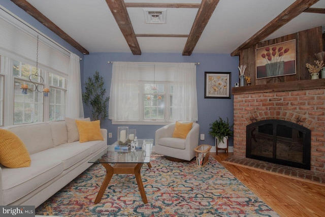716 Old Fallston Rd, Fallston, MD 21047 - living room with beam ceiling, wood finished floors, and a brick fireplace