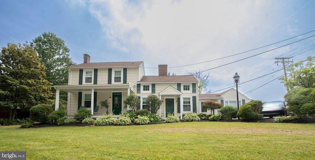 716 Old Fallston Rd, Fallston, MD 21047 - view of front of home with a porch, a front lawn, and a chimney