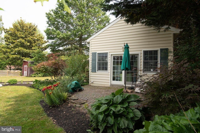 716 Old Fallston Rd, Fallston, MD 21047 - view of home's exterior with a yard, a patio, and a storage unit