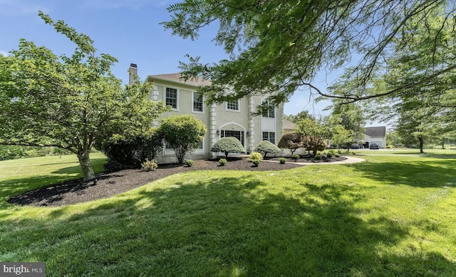 96 Becks Blvd, Ringoes, NJ 08551 - rear view of house featuring a lawn, stucco siding, and a chimney
