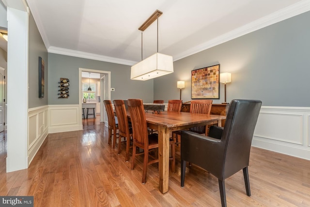 96 Becks Blvd, Ringoes, NJ 08551 - dining space with ornamental molding, light wood-style floors, a decorative wall, and a wainscoted wall