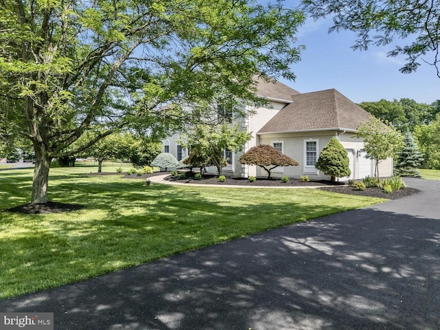 96 Becks Blvd, Ringoes, NJ 08551 - view of front of property featuring stucco siding, a garage, a front lawn, roof with shingles, and driveway