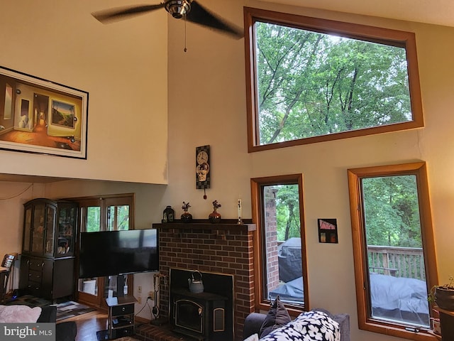 27 Gladys Trl, Fairfield, PA 17320 - living room with a high ceiling, a ceiling fan, and a wood stove