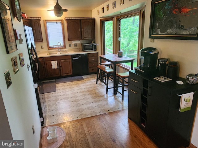 27 Gladys Trl, Fairfield, PA 17320 - kitchen with black dishwasher, freestanding refrigerator, stainless steel microwave, light countertops, and light floors