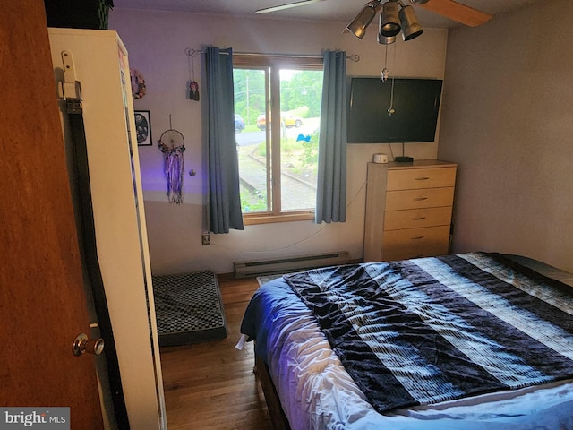 27 Gladys Trl, Fairfield, PA 17320 - bedroom with a baseboard heating unit, wood finished floors, and a ceiling fan