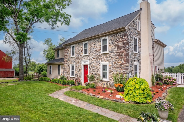 694 Ridge Rd, Telford, PA 18969 - view of front of house with stone siding, a chimney, and roof with shingles