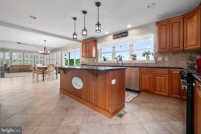 694 Ridge Rd, Telford, PA 18969 - kitchen featuring stainless steel dishwasher, range with electric cooktop, a chandelier, a breakfast bar area, and backsplash