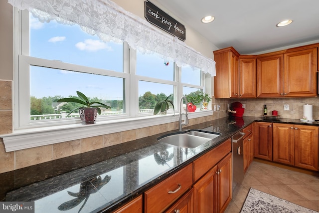 694 Ridge Rd, Telford, PA 18969 - kitchen with brown cabinets, tasteful backsplash, dark stone counters, and recessed lighting