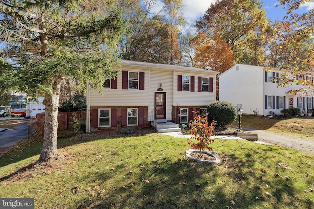 14361 Springbrook Ct, Woodbridge, VA 22193 - bi-level home featuring a front lawn and brick siding