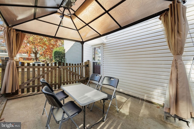 14361 Springbrook Ct, Woodbridge, VA 22193 - view of patio / terrace with outdoor dining space and a gazebo