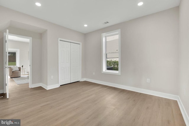 9204 Douglas St, Manassas, VA 20110 - unfurnished bedroom featuring light wood-type flooring, recessed lighting, and a closet