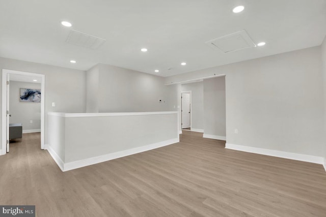 9204 Douglas St, Manassas, VA 20110 - empty room with light wood-style flooring, attic access, and recessed lighting