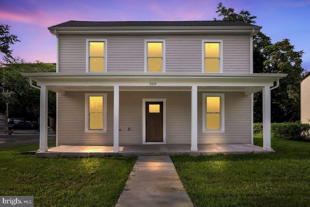9204 Douglas St, Manassas, VA 20110 - view of front of property with covered porch and a front yard