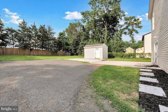 9204 Douglas St, Manassas, VA 20110 - view of yard featuring a storage shed and a patio