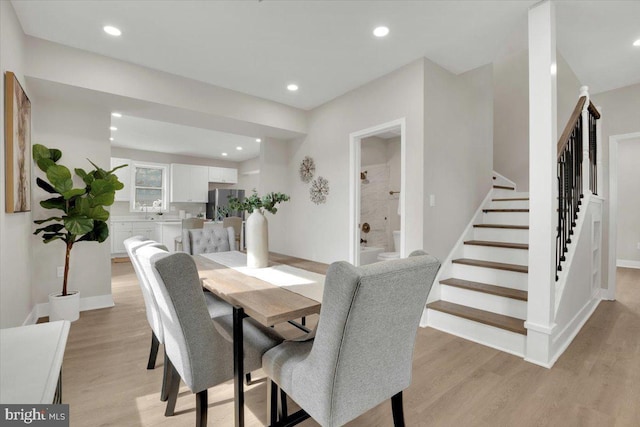 9204 Douglas St, Manassas, VA 20110 - dining area featuring stairs, light wood-type flooring, and recessed lighting