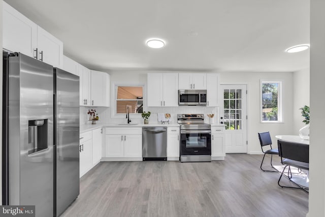 125 Walt Whitman Blvd, Cherry Hill, NJ 08003 - kitchen featuring appliances with stainless steel finishes, light wood-style flooring, light countertops, and white cabinets
