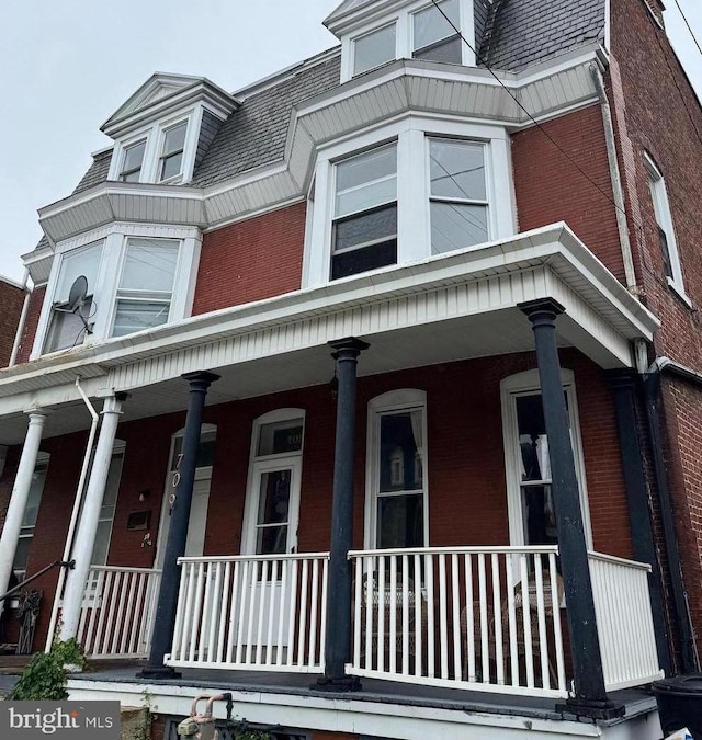 709 W King St, York, PA 17401 - view of home's exterior with covered porch and brick siding