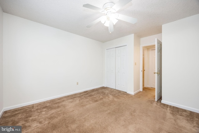 753 Canvasback Ct Unit 204, Salisbury, MD 21804 - unfurnished bedroom with light colored carpet, a closet, a textured ceiling, and ceiling fan