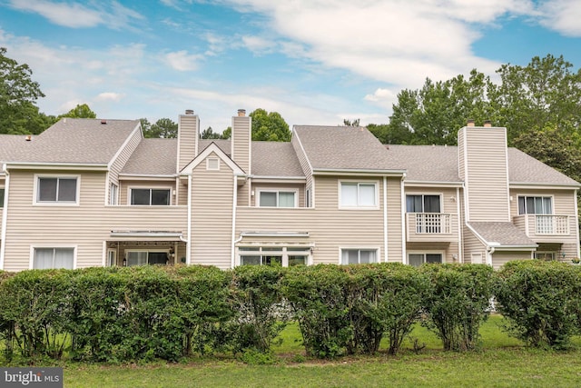 753 Canvasback Ct Unit 204, Salisbury, MD 21804 - back of property featuring a chimney and a lawn