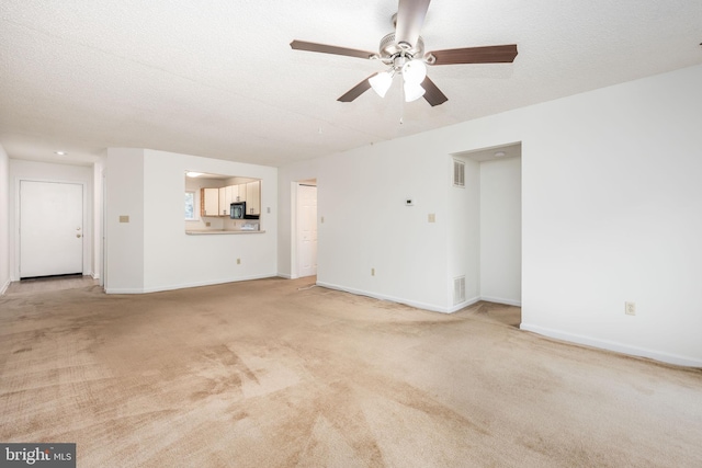753 Canvasback Ct Unit 204, Salisbury, MD 21804 - unfurnished living room featuring a ceiling fan and light colored carpet
