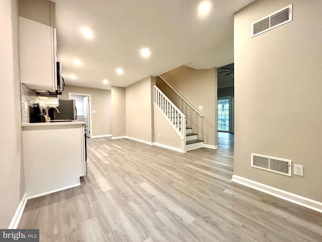 1078 Lakeview Dr, Cross Junction, VA 22625 - kitchen featuring white cabinets, light wood finished floors, light countertops, recessed lighting, and stainless steel appliances