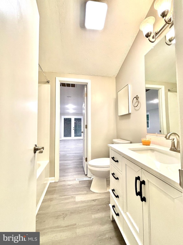 1078 Lakeview Dr, Cross Junction, VA 22625 - full bath featuring vanity, wood finished floors, shower / bath combination, and a textured ceiling