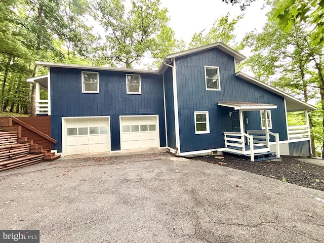 1078 Lakeview Dr, Cross Junction, VA 22625 - view of front of house with an attached garage, asphalt driveway, and stairs
