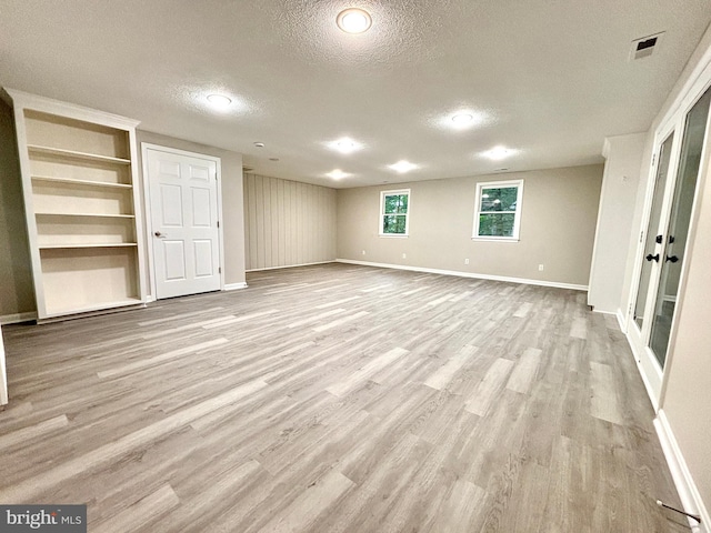 1078 Lakeview Dr, Cross Junction, VA 22625 - empty room with a textured ceiling, wood finished floors, and built in shelves