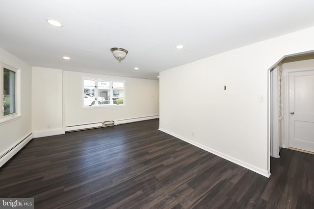 106 N Warminster Rd, Hatboro, PA 19040 - unfurnished room with dark wood-type flooring, recessed lighting, arched walkways, baseboard heating, and a baseboard heating unit