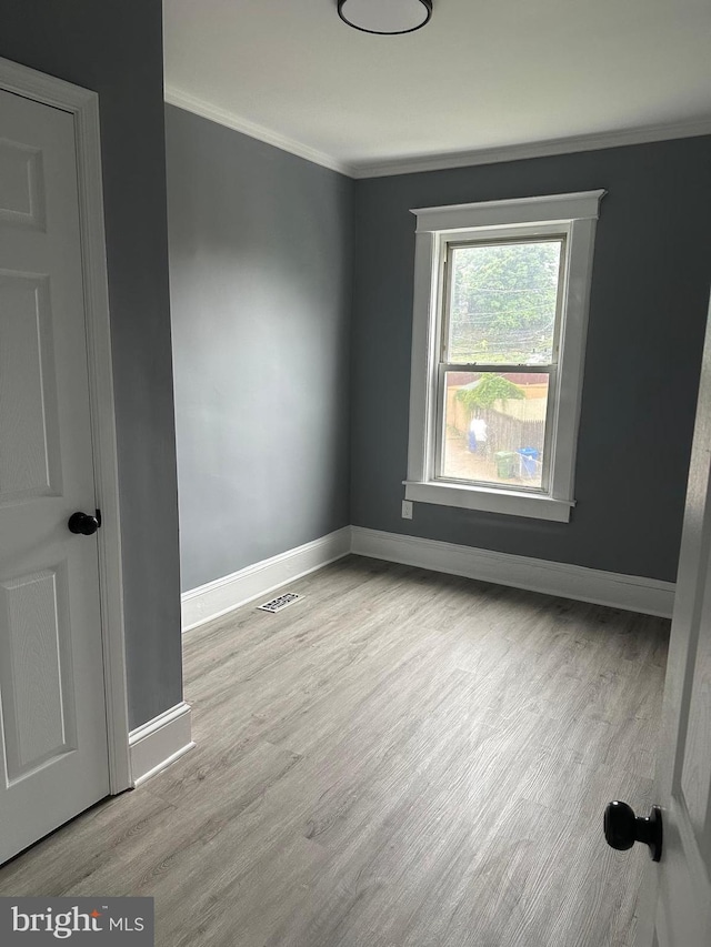 3720 Brooklyn, Baltimore, MD 21225 - spare room featuring ornamental molding and wood finished floors